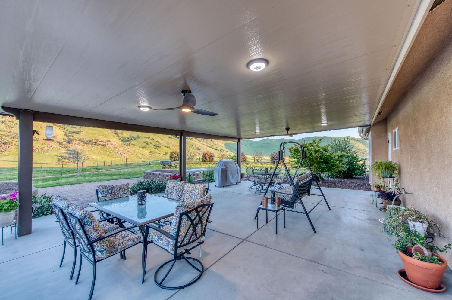 20431 Thermal Road Sanger, CA 93657 - Photo 29 of 88 a view of an outdoor dining space with furniture and garden view