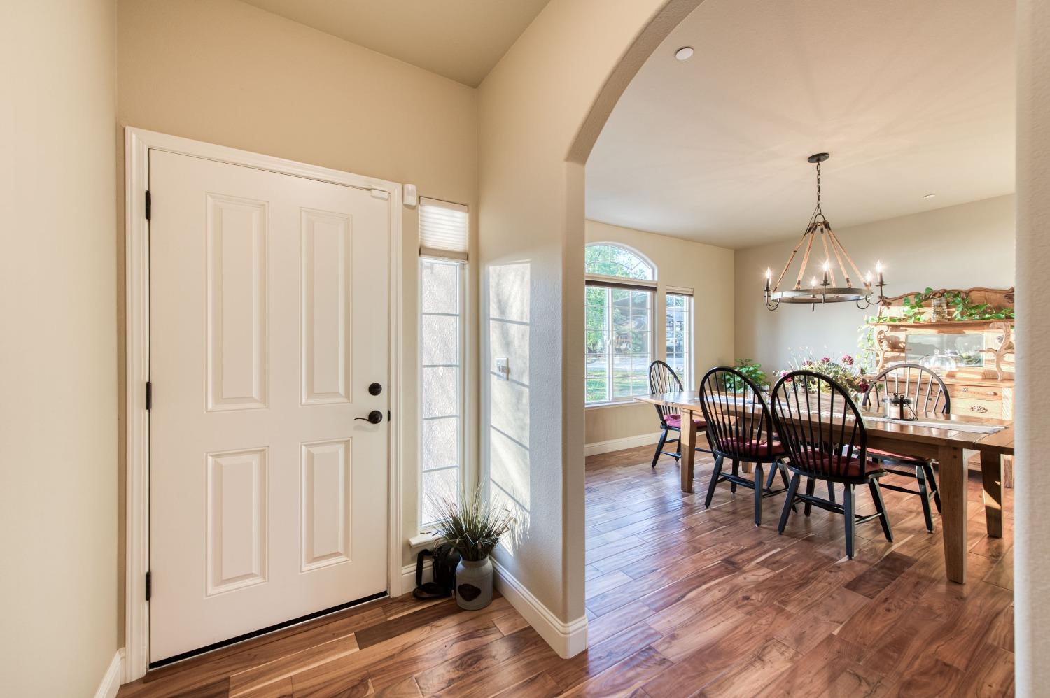 20431 Thermal Road Sanger, CA 93657 - Photo 3 of 88 a view of a a dining room with furniture window and wooden floor
