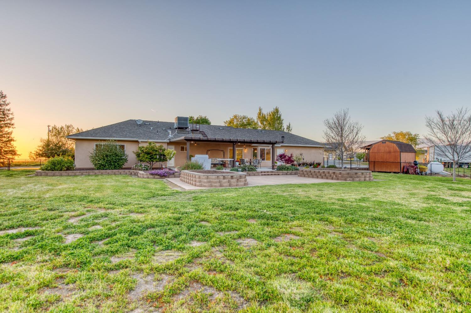 20431 Thermal Road Sanger, CA 93657 - Photo 35 of 88 a aerial view of a house with garden space and a street view