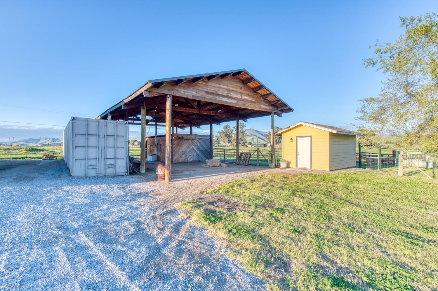 20431 Thermal Road Sanger, CA 93657 - Photo 43 of 88 a view of a house with backyard and porch
