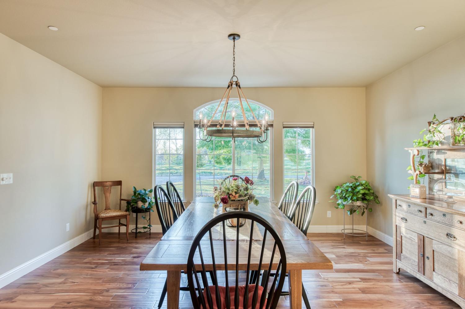 20431 Thermal Road Sanger, CA 93657 - Photo 5 of 88 a view of a dining room with furniture window and wooden floor