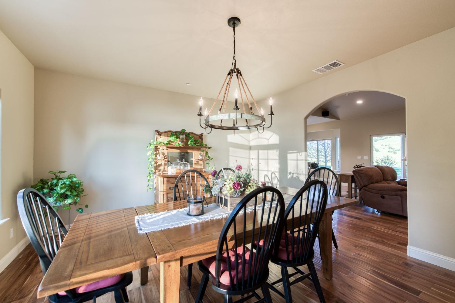 20431 Thermal Road Sanger, CA 93657 - Photo 6 of 88 a view of a dining room with furniture window and wooden floor