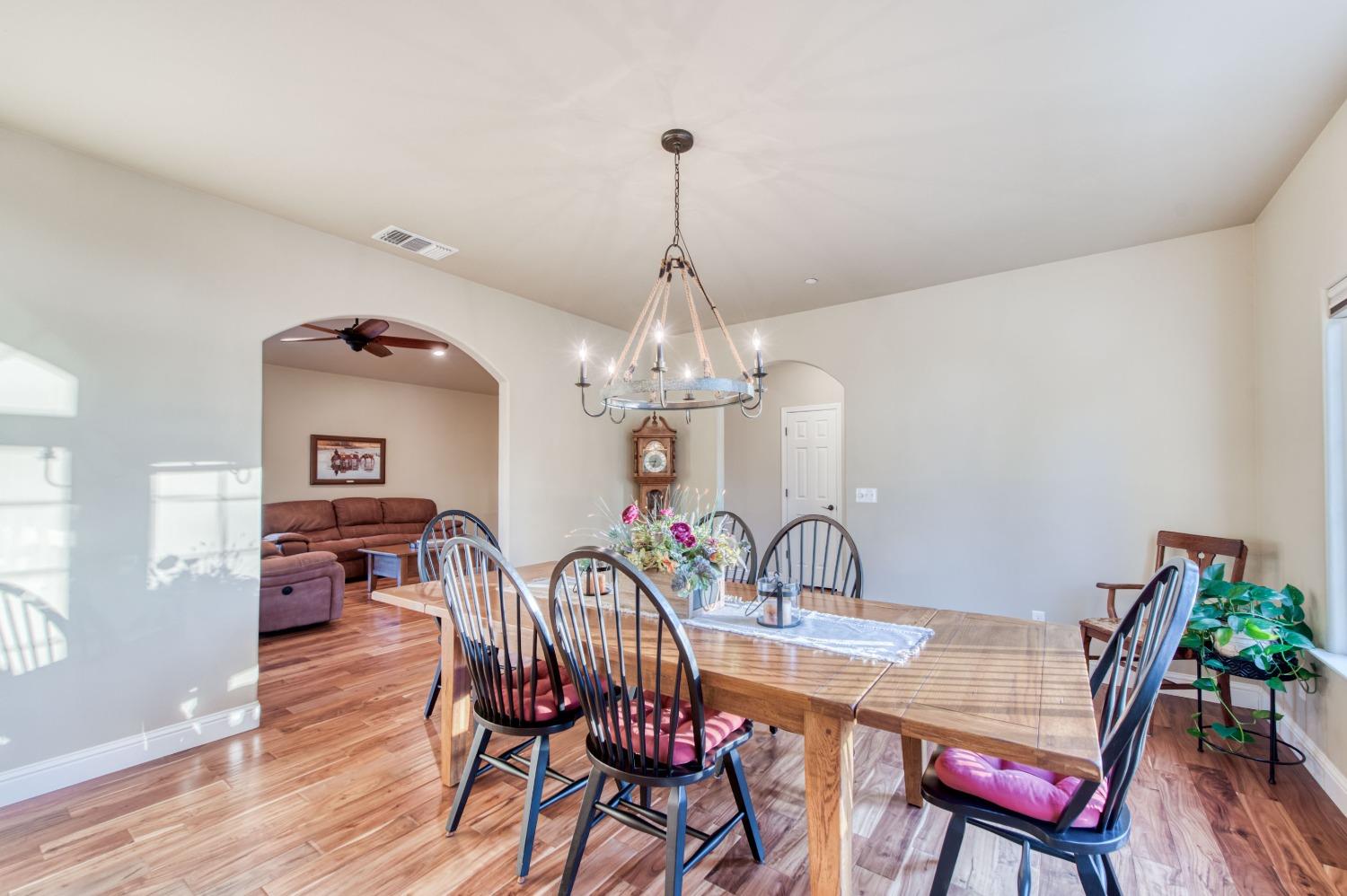 20431 Thermal Road Sanger, CA 93657 - Photo 7 of 88 a view of a dining room with furniture wooden floor and chandelier
