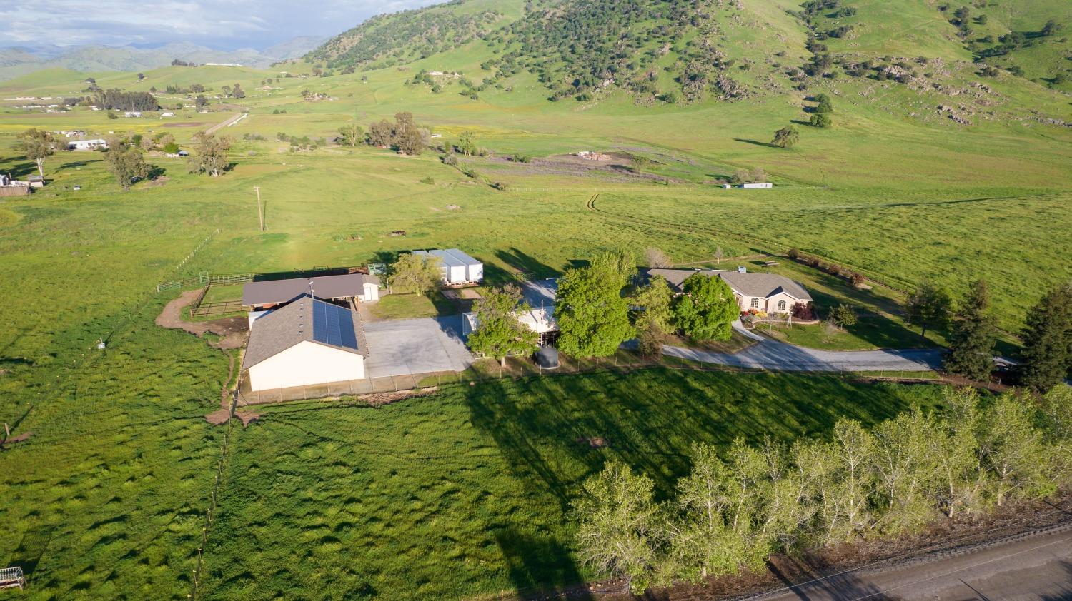 20431 Thermal Road Sanger, CA 93657 - Photo 74 of 88 a view of a lake with a building in the background