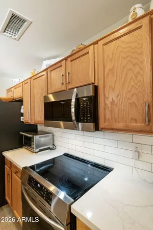 a kitchen with a stove and a microwave