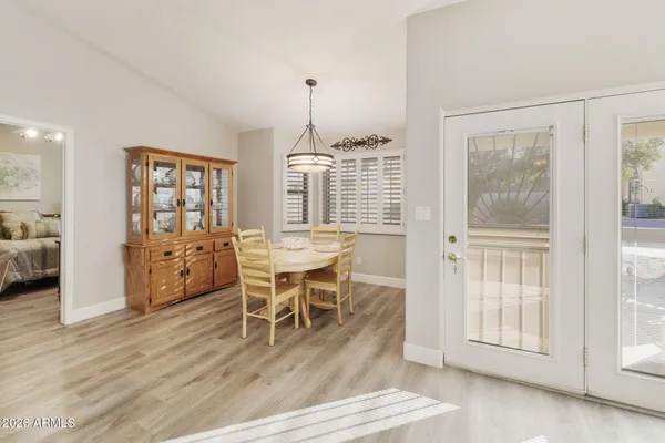 a dining room with furniture and window