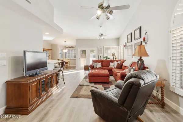 a living room with furniture and a flat screen tv