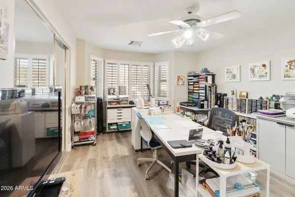 a living room with furniture a large window and a table