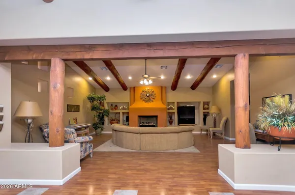 a living room with fireplace furniture and a flat screen tv