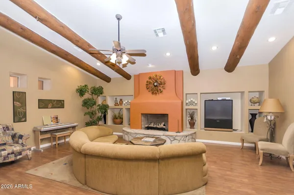 a living room with furniture and a chandelier