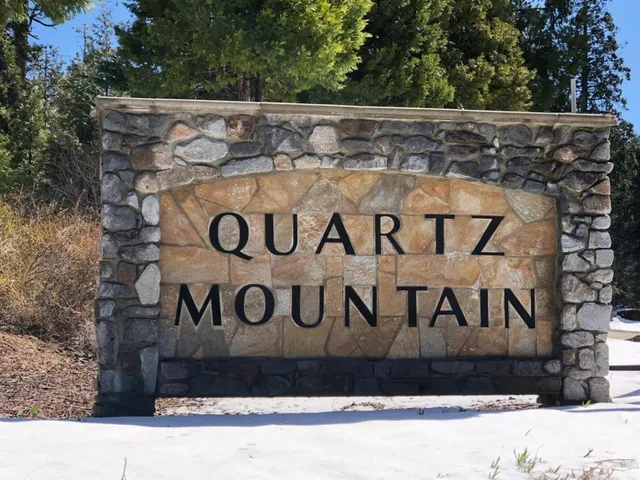 a street sign on a wall with sign board