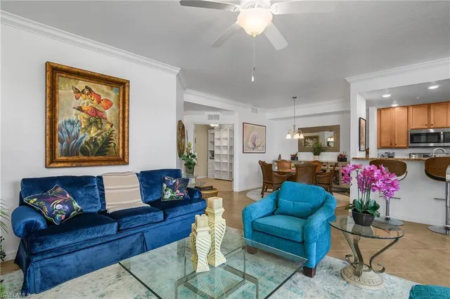 a living room with furniture flowerpot and window