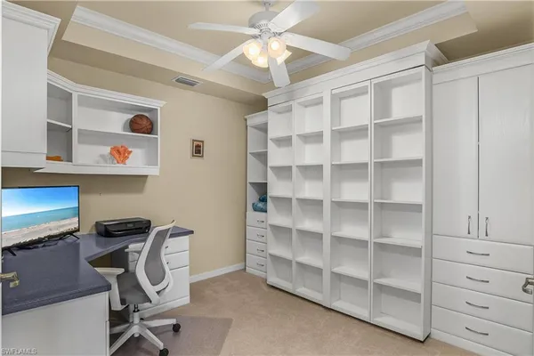 a view of a workspace with furniture