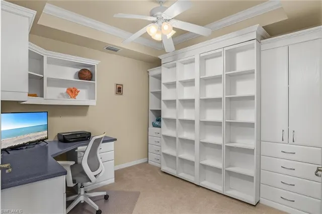 a view of a workspace with furniture