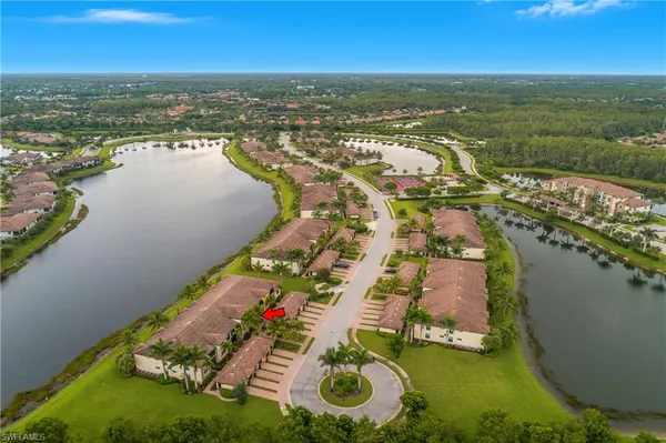 an aerial view of ocean residential house with outdoor space and trees around