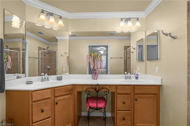a bathroom with a double vanity sink mirror and a