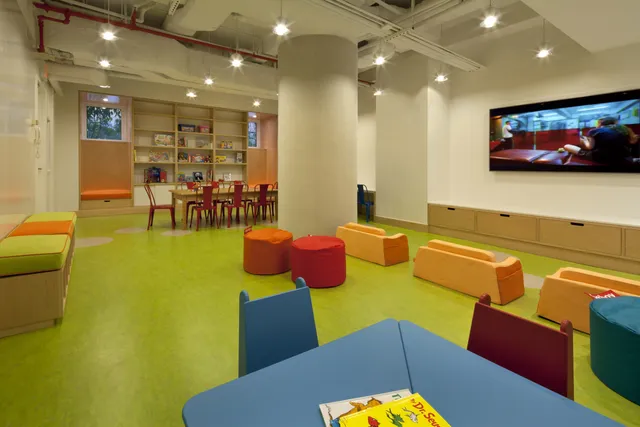 a living room with furniture and a pool