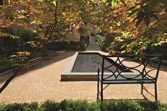 a view of a swimming pool with a yard