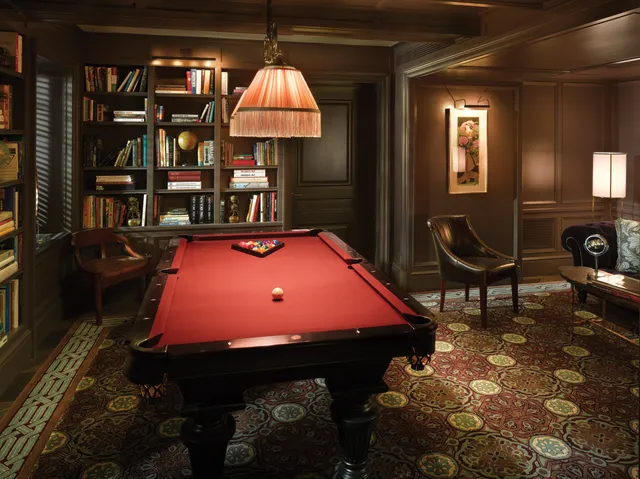 a room with furniture a rug and a chandelier