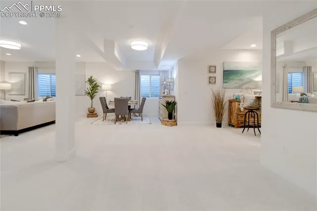 a living room with furniture and a table