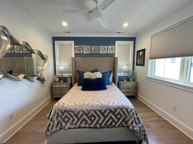 a bedroom with a bed and a couch