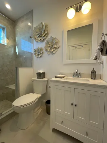 a bedroom with a bed and glass wall