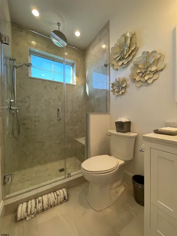 a bedroom with a bed and a flat tv screen