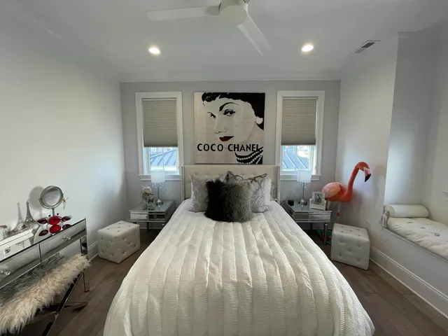 a room with wooden floor and white walls