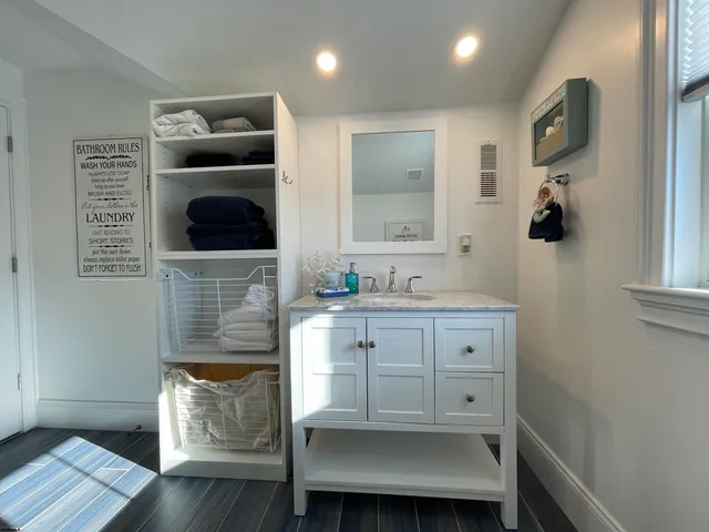 a bed room with a bed and a chair