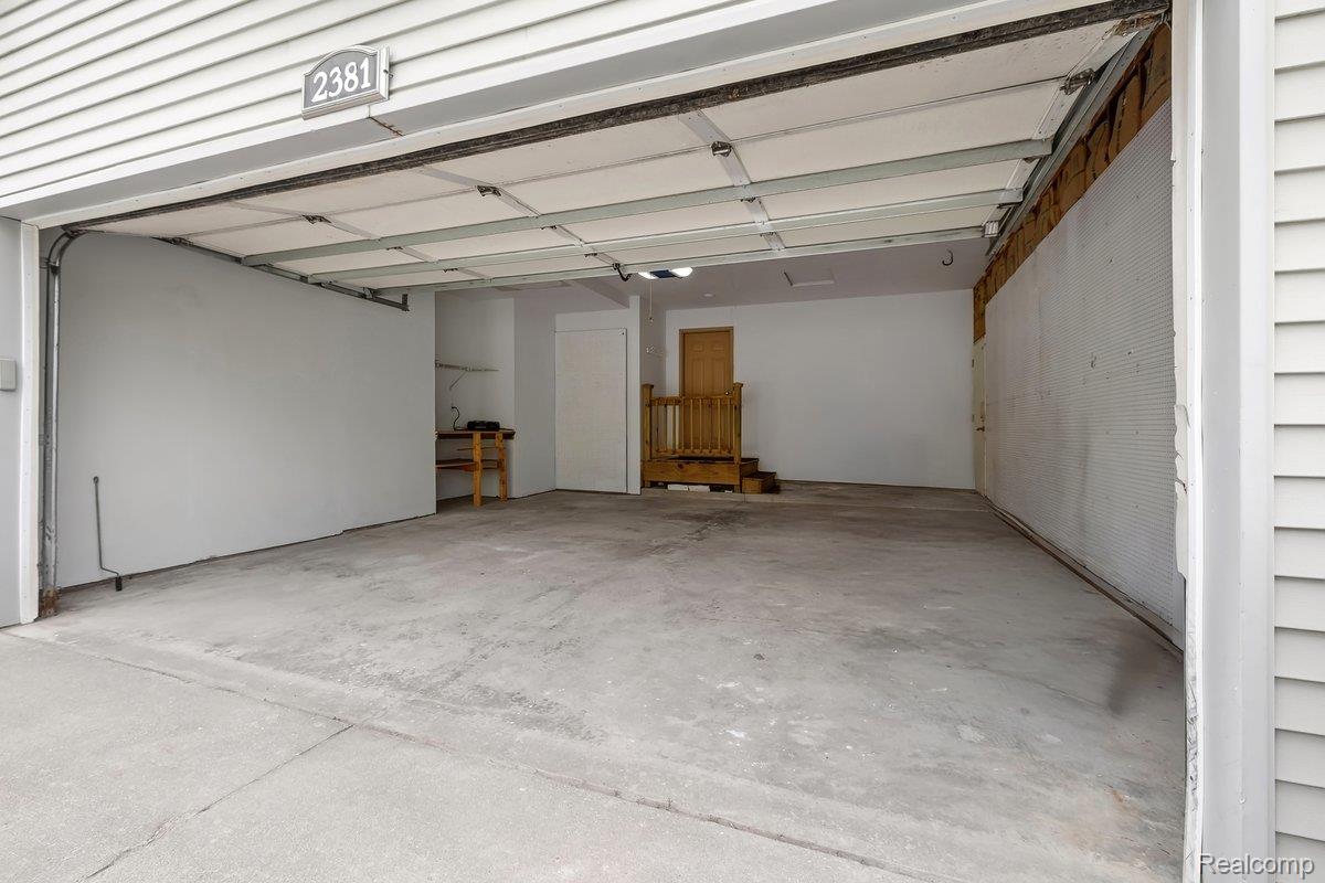 2381 Burke Road Fowlerville, MI 48836 - Photo 24 of 31 Nice Garage for cars and storage with EV plug