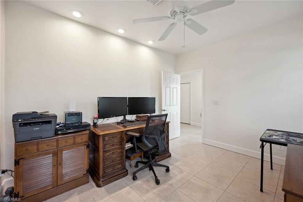 10082 Vanderbilt Drive Naples, FL 34108 - Photo 16 of 43 a view of a workspace with furniture