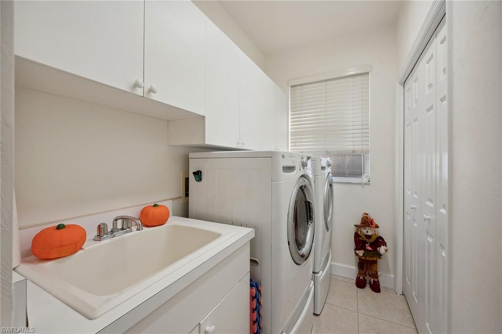 10082 Vanderbilt Drive Naples, FL 34108 - Photo 28 of 43 a view of a storage & utility room with washer and dryer