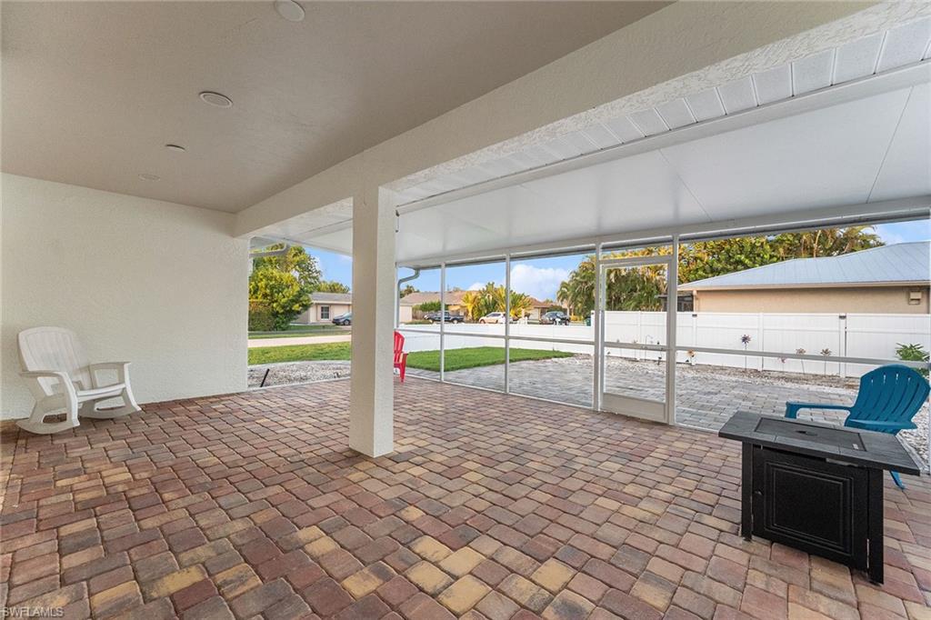 10082 Vanderbilt Drive Naples, FL 34108 - Photo 29 of 43 a view of a patio with table and chairs