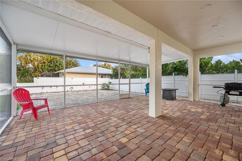 10082 Vanderbilt Drive Naples, FL 34108 - Photo 30 of 43 a view of a room with wooden floor and fence