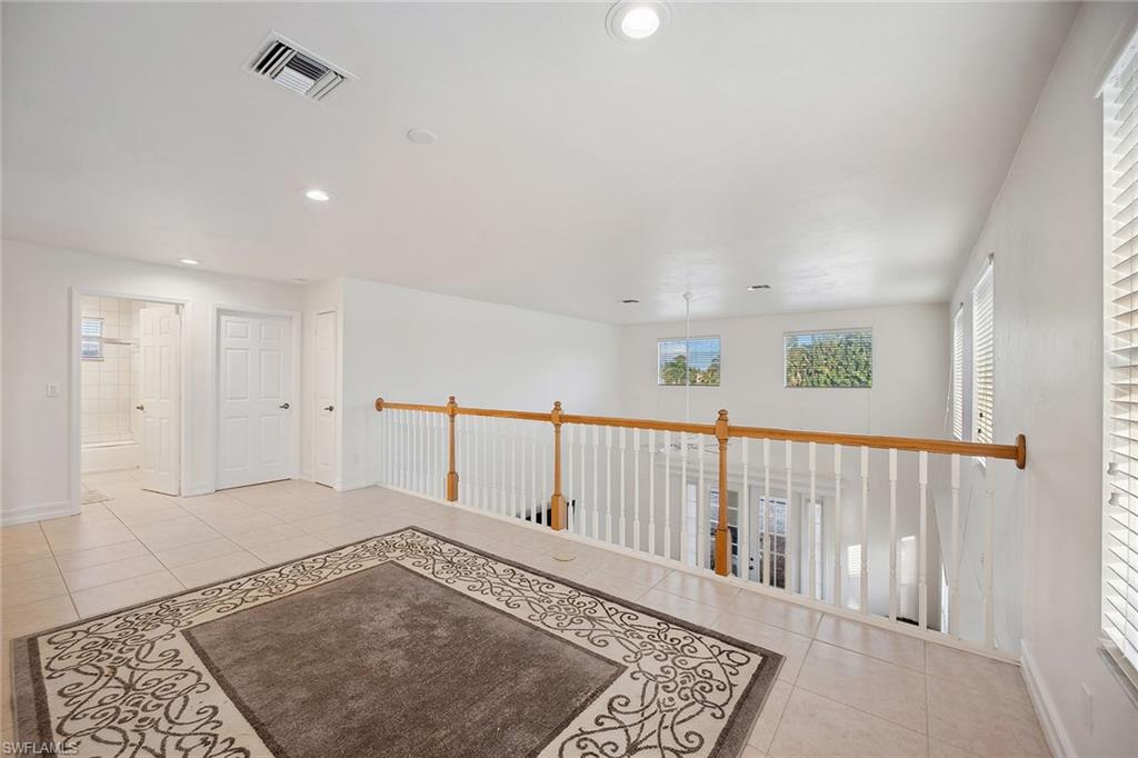 10082 Vanderbilt Drive Naples, FL 34108 - Photo 31 of 43 a view of an entryway with a rug