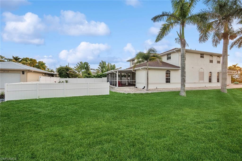 10082 Vanderbilt Drive Naples, FL 34108 - Photo 35 of 43 a view of a house with backyard