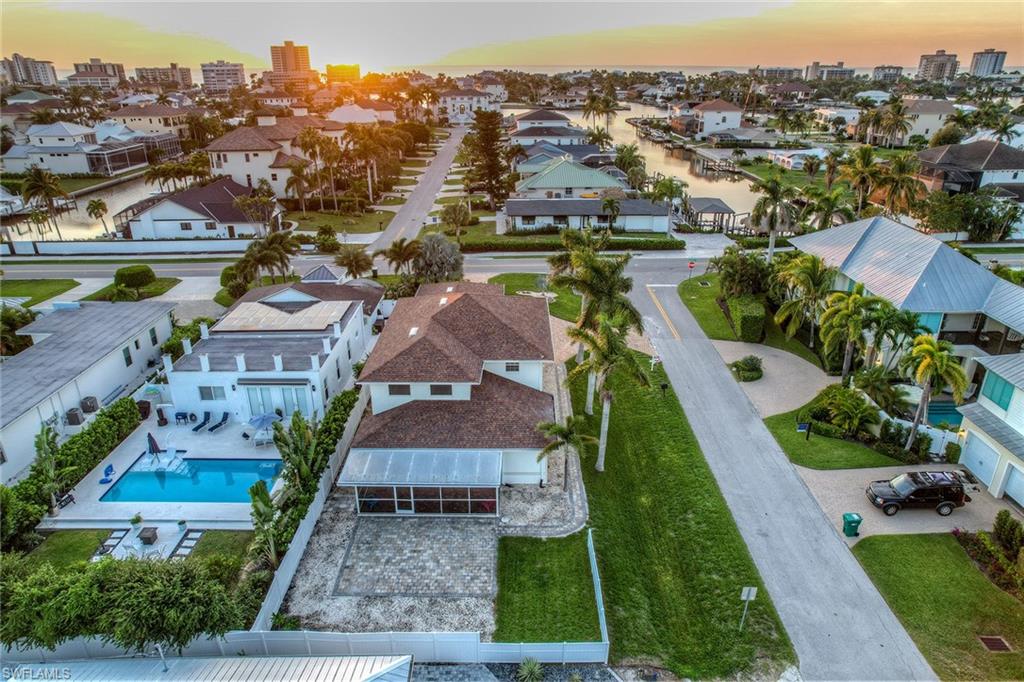 10082 Vanderbilt Drive Naples, FL 34108 - Photo 39 of 43 an aerial view of multiple houses with yard