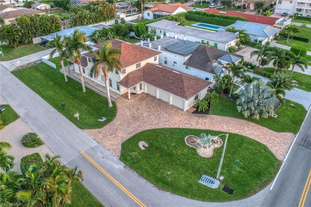10082 Vanderbilt Drive Naples, FL 34108 - Photo 40 of 43 a view of a house with a swimming pool
