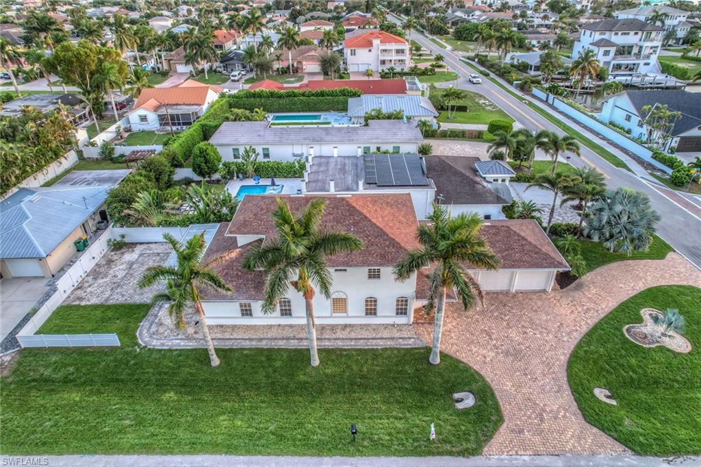 10082 Vanderbilt Drive Naples, FL 34108 - Photo 4 of 43 an aerial view of residential houses with outdoor space and street view