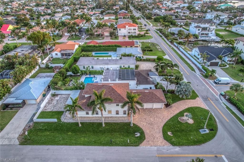 10082 Vanderbilt Drive Naples, FL 34108 - Photo 41 of 43 an aerial view of residential houses with outdoor space and parking