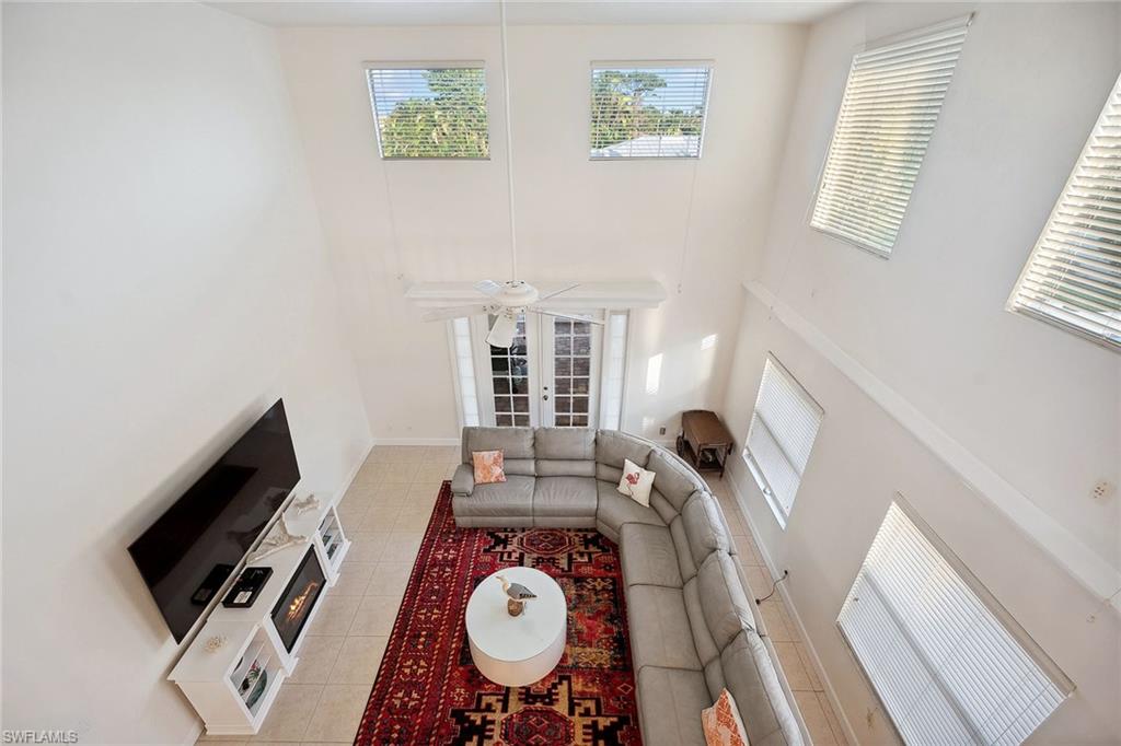 10082 Vanderbilt Drive Naples, FL 34108 - Photo 10 of 43 a view of a workspace with furniture and a window