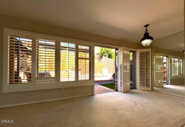a view of an empty room with a window