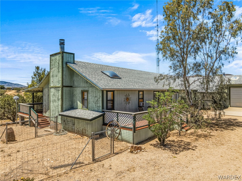 2401 North Stephan Road Kingman, AZ 86401 - Photo 11 of 92 a patio with a yard table and chairs