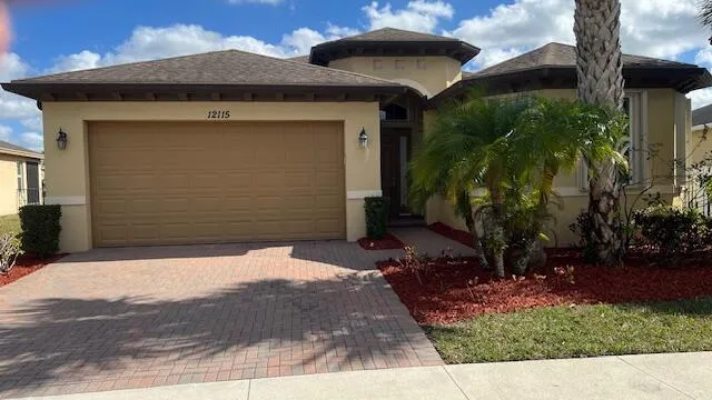 a large kitchen with stainless steel appliances granite countertop a large counter top a stove a chimney a sink and cabinets