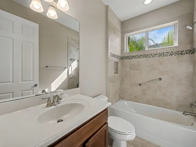a view of a balcony with floor to ceiling windows with wooden floor