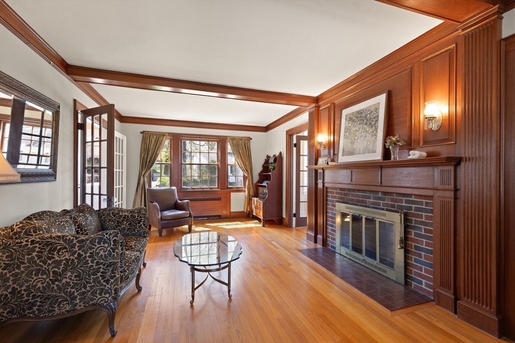 2 Plymouth Road Lexington, MA 02421 - Photo 11 of 38 a living room with furniture a fireplace and a large window