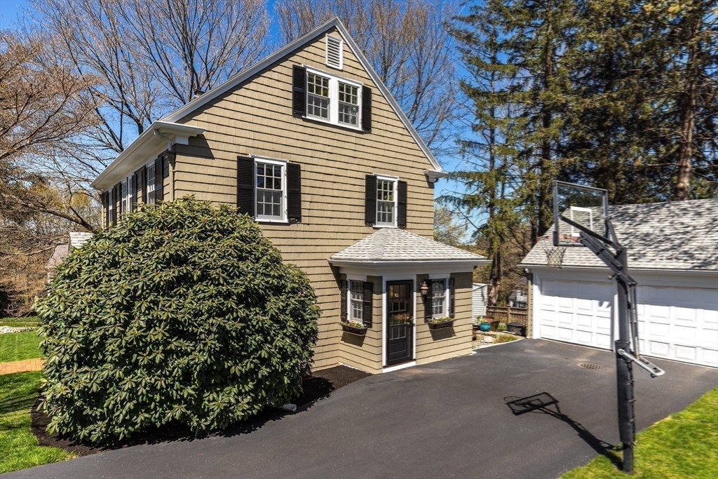 2 Plymouth Road Lexington, MA 02421 - Photo 32 of 38 a front view of a house with garden
