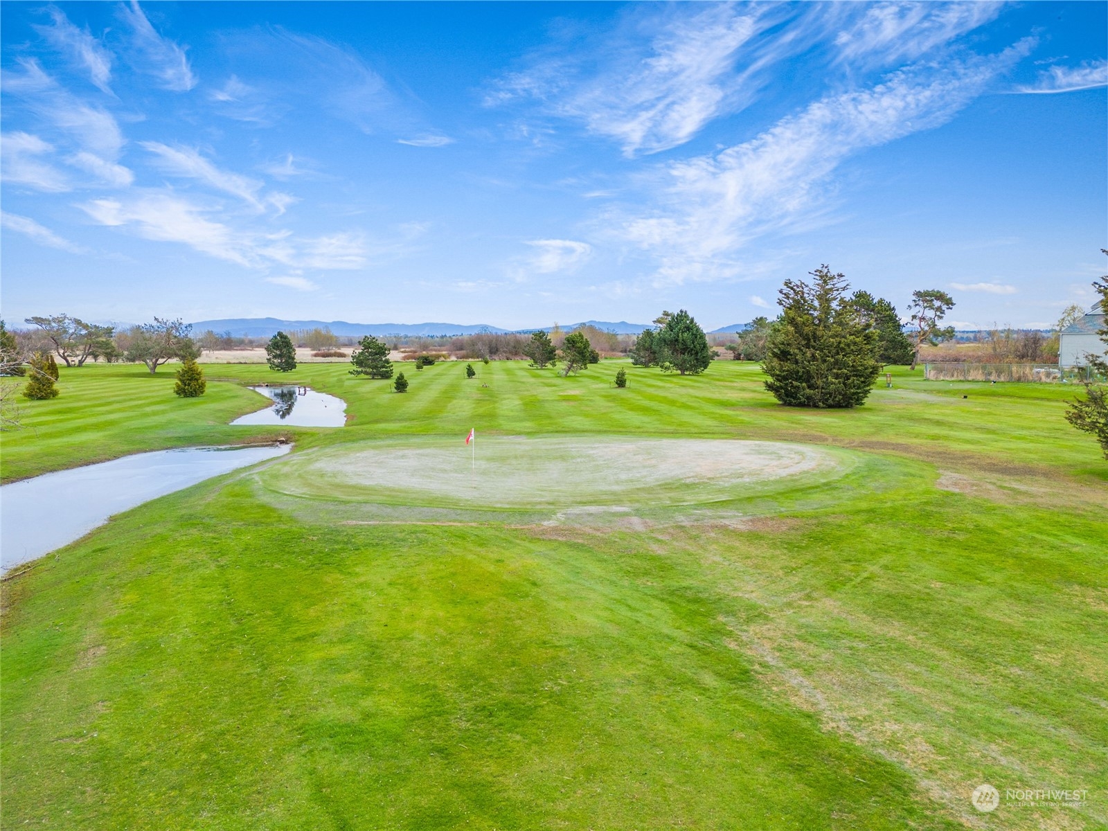 4542 Decatur Drive Ferndale, WA 98248 - Photo 15 of 24 a view of a golf course with a house