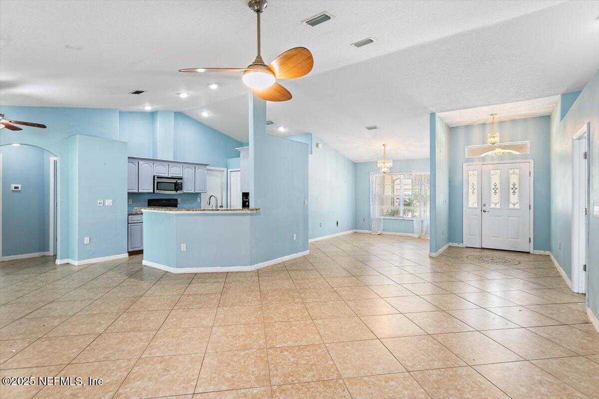 170 Secretary Trail Palm Coast, FL 32164 - Photo 8 of 22 08-Living Room to Kitchen