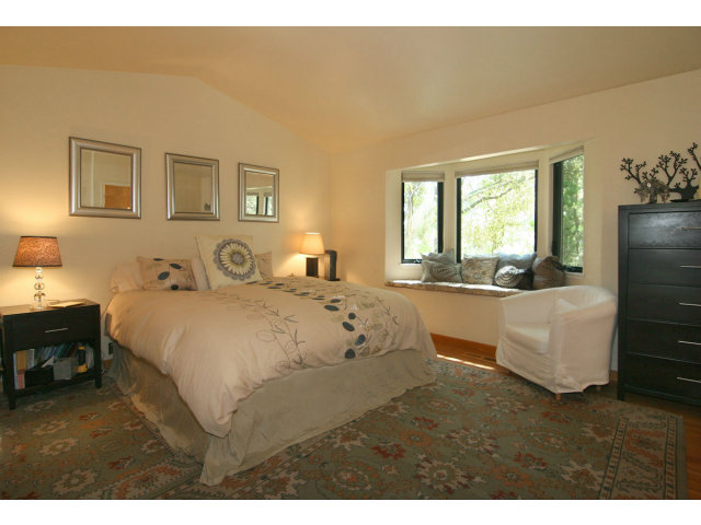 455 Poppy Hill Road Watsonville, CA 95076 - Photo 13 of 25 a bed room with a bed window and a table chair